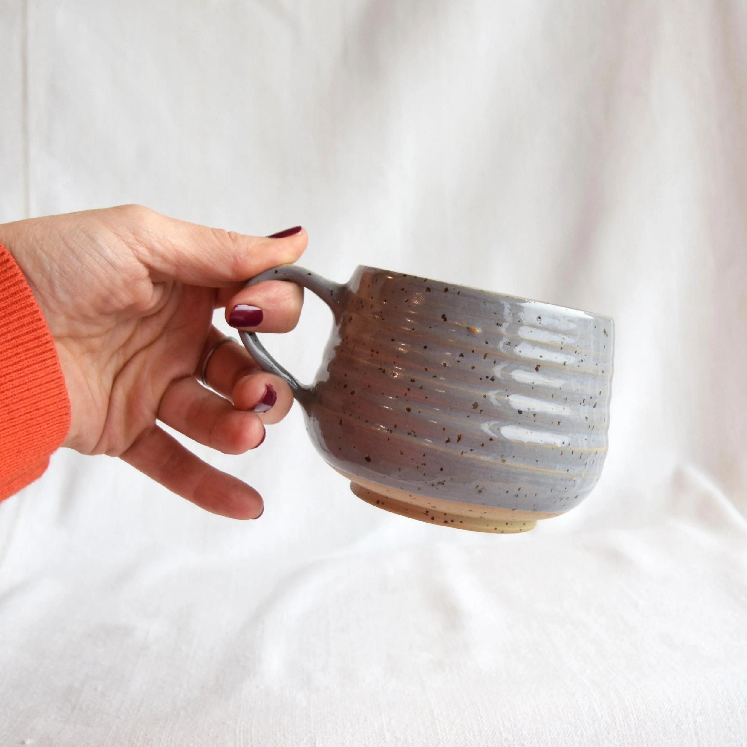 grey mug hand.jpg