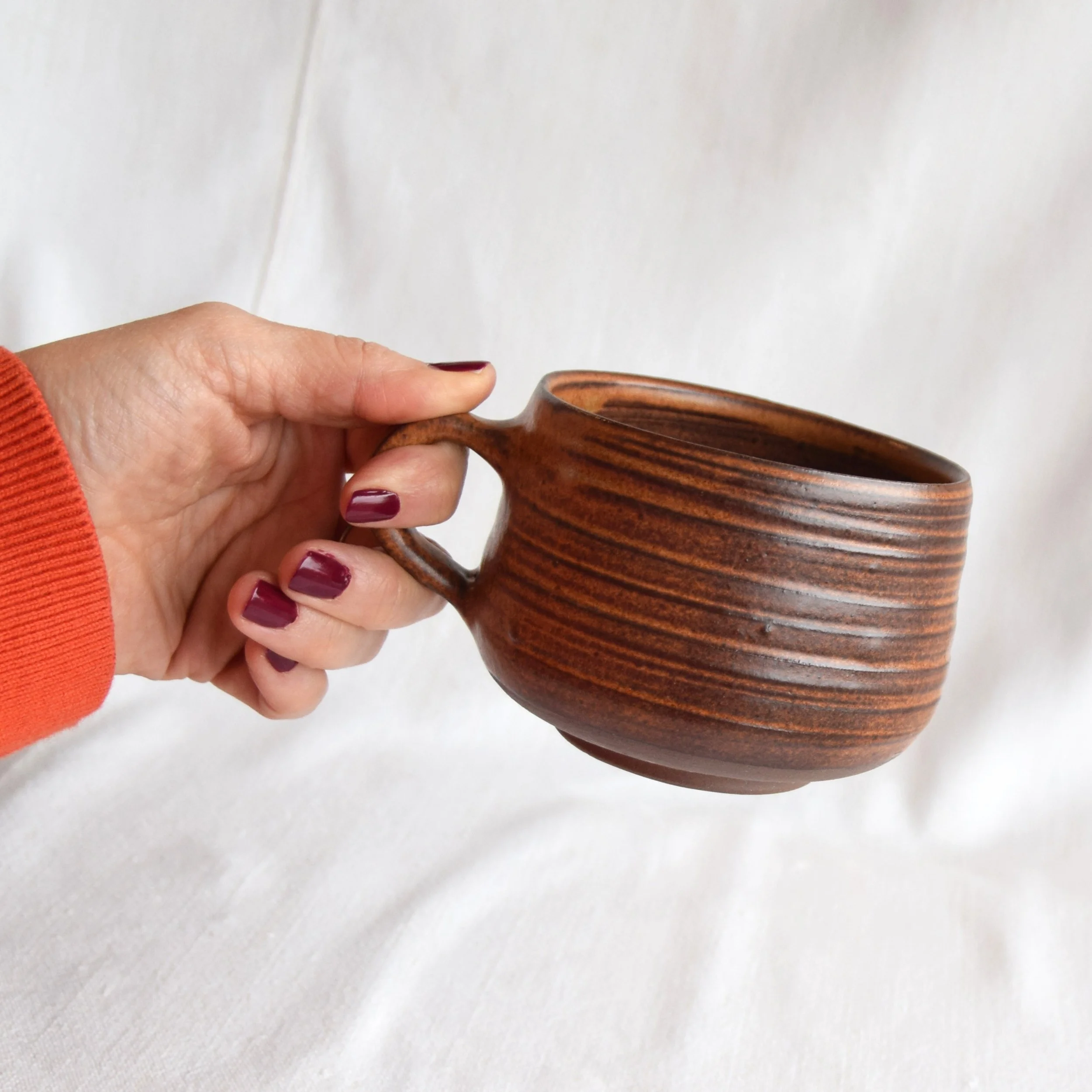 brown mug hand.jpg