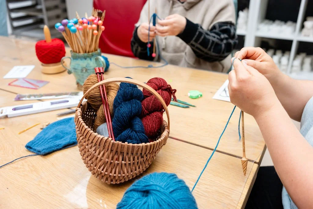 Students learning to knit