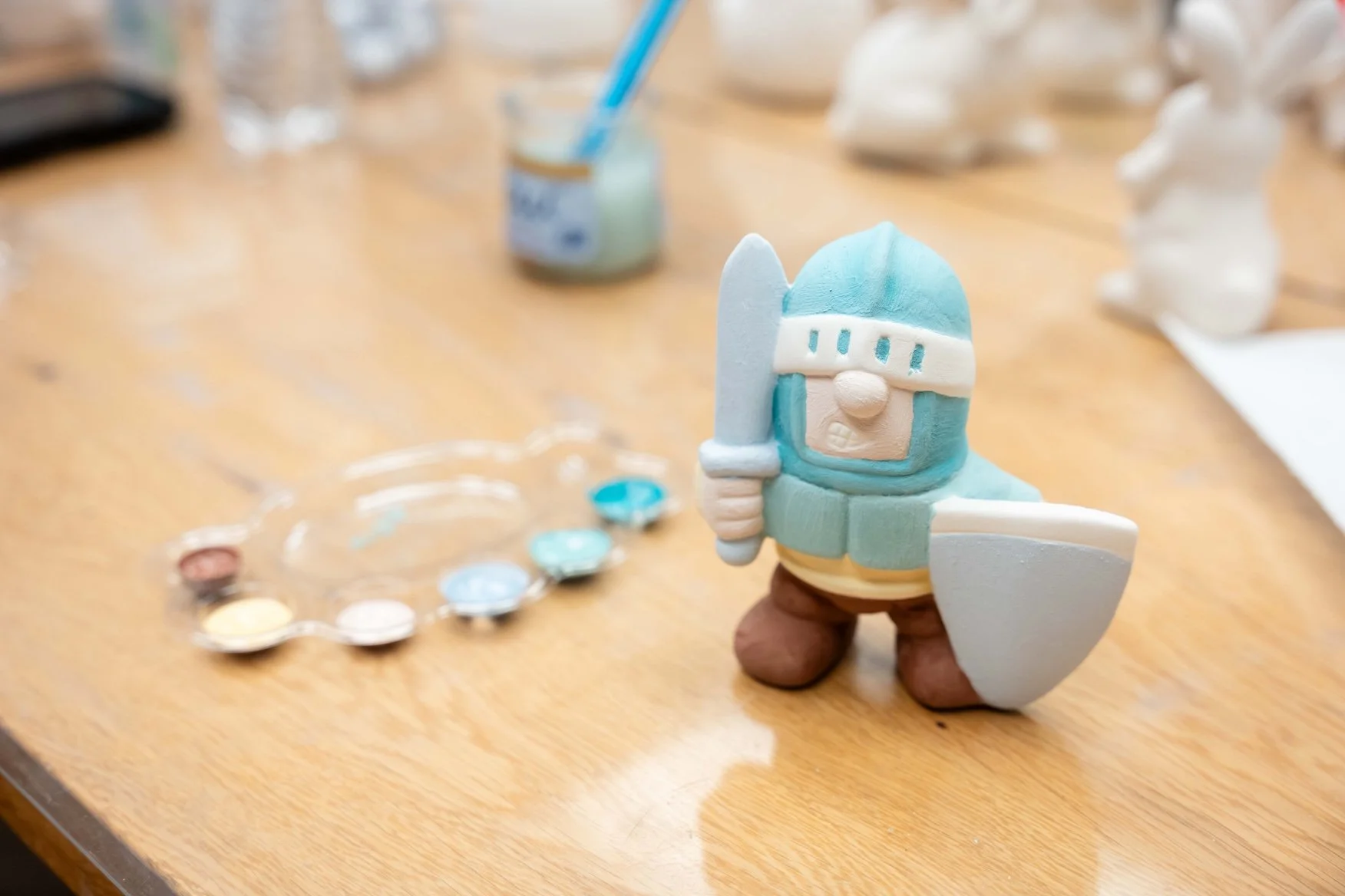 A Paint-Your-Own-Pottery knight figurine painted at Staunton Clayground