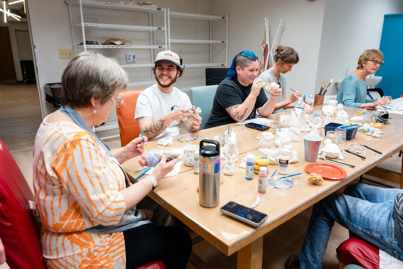 Clayground members enjoy painting pottery together