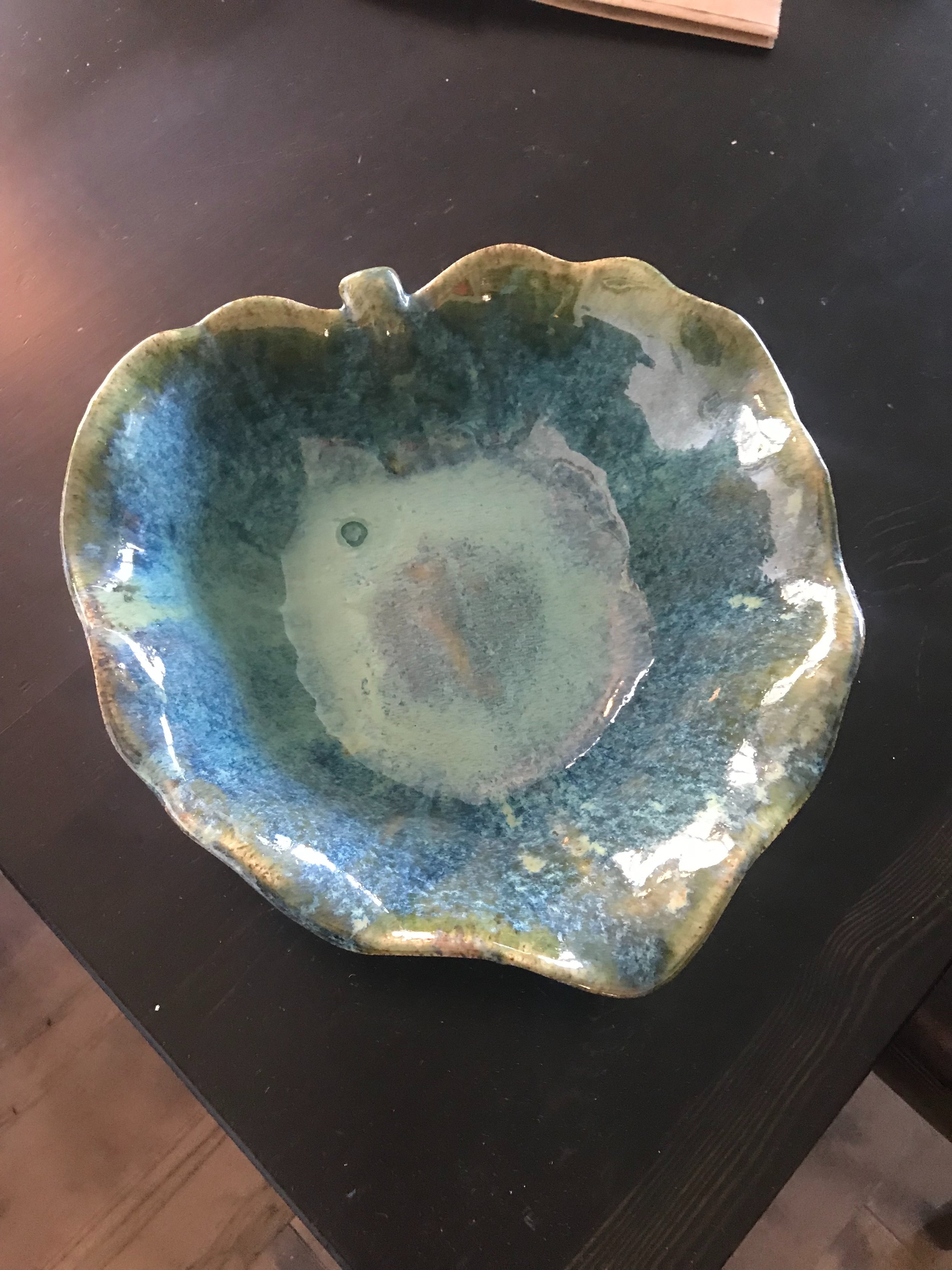 Handbuilt blue and white opalescent platter shaped like a leaf