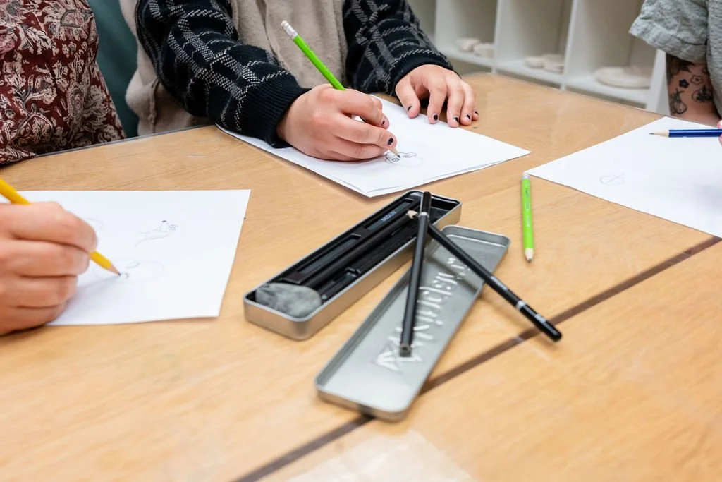 Students learning to draw manga