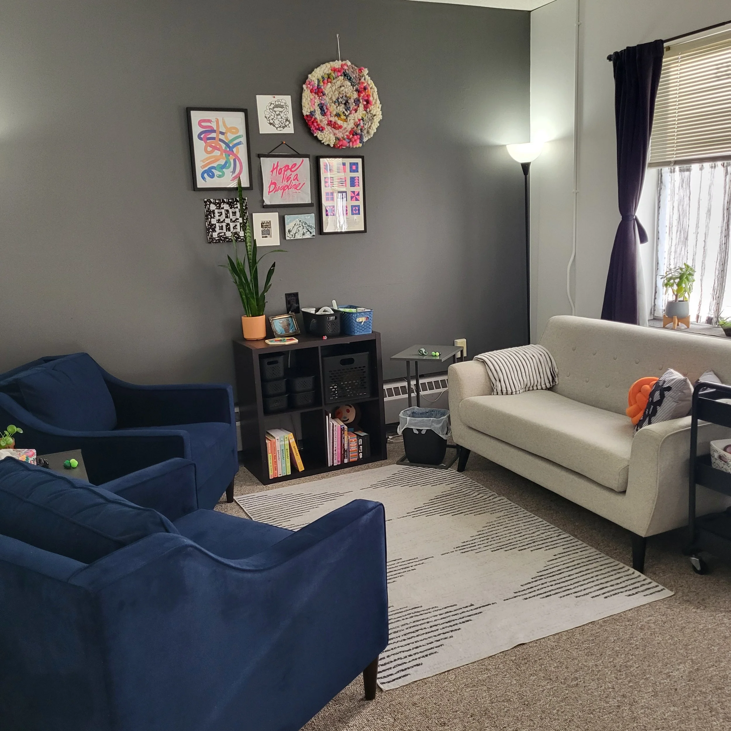 Bright, colorful, inviting therapy office with several comfortable seating options.