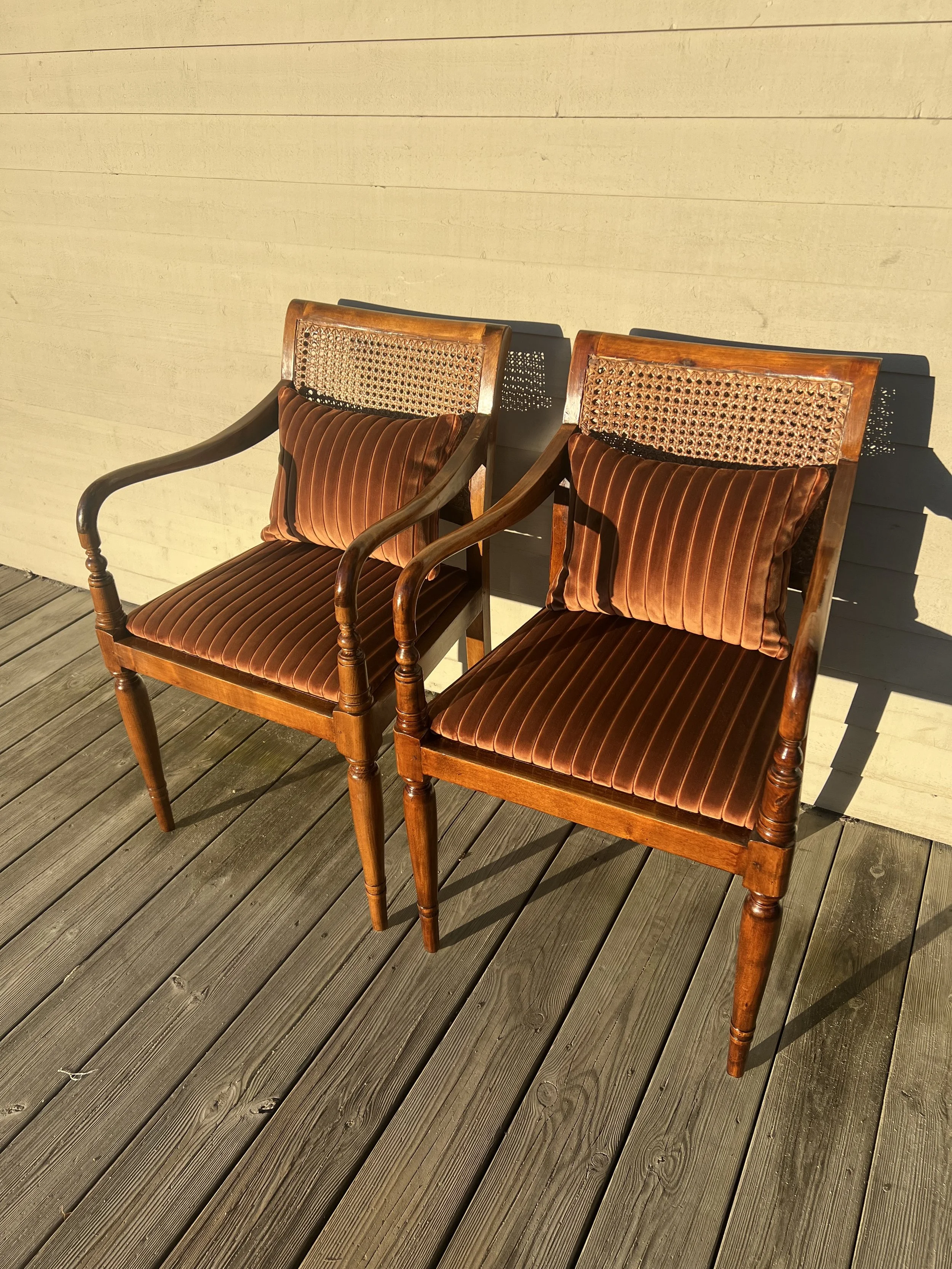 Två karmstolar med traditionell rottingflätning. Nytillverkade sitsar klädda i Cordial, Sydtextil