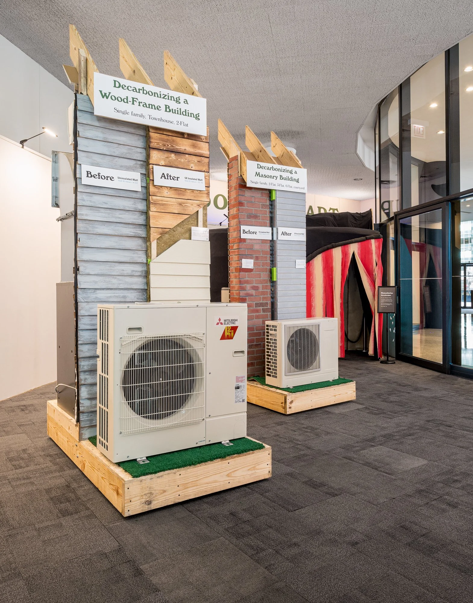 Demonstration walls showing construction techniques, building envelopes, and heat pump technology.