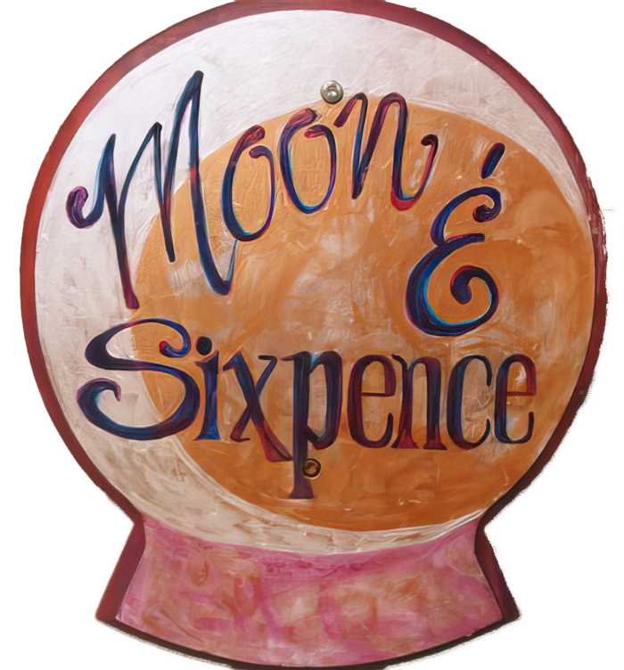 Sign reading 'Moong & & Sixpence' with colorful, artistic lettering.