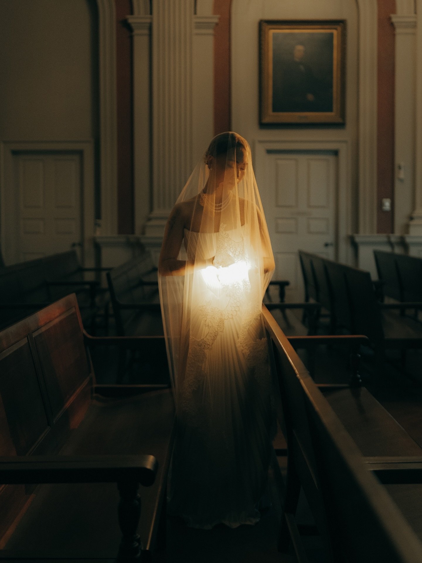 I&rsquo;ve been chasing this shot for a long time.

A bride. City Hall. One beam of light through a veil that turns everything gold. I knew what I wanted before we walked in. Getting it is a different story.

She stood still for maybe three seconds. 