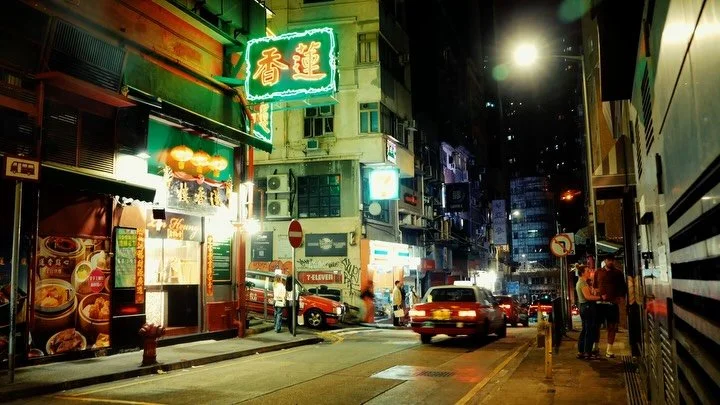 February. Just passing through Hong Kong.

I almost left the camera at the hotel. But this city has a way of making you feel like you can&rsquo;t show up empty-handed.
The neon is mostly gone now. The taxi that used to feel like part of the skyline i