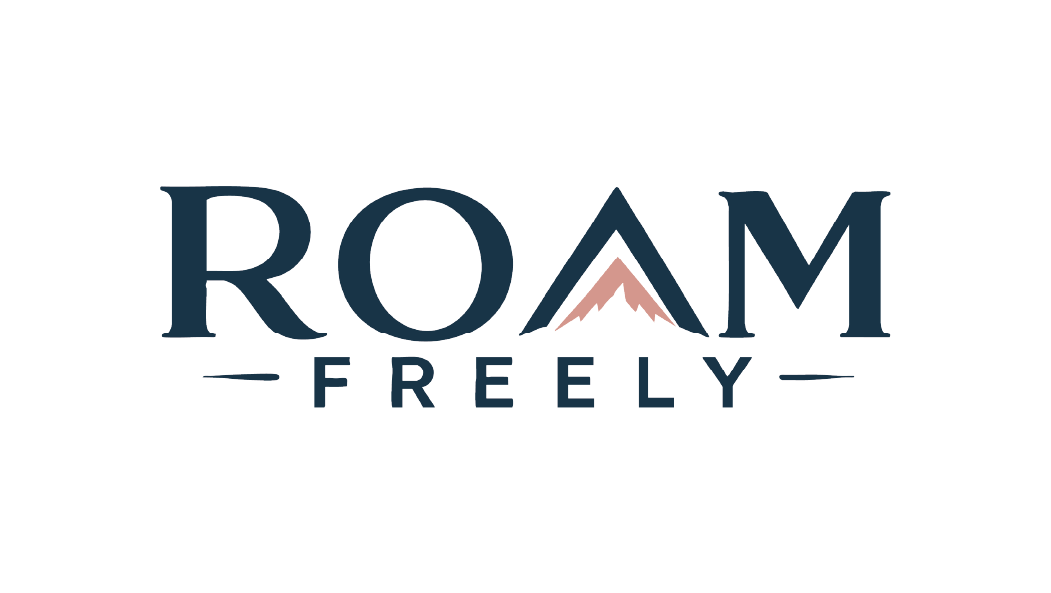 Logo with the words "ROAM FREELY" and a mountain peak integrated into the letter "A."