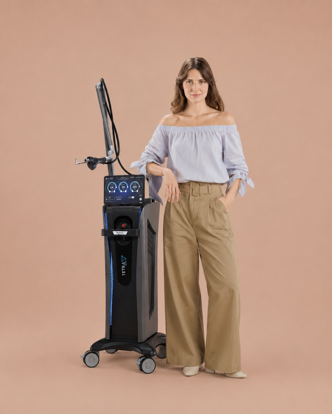 A woman standing next to a medical or aesthetic device with a digital display, against a plain beige background.