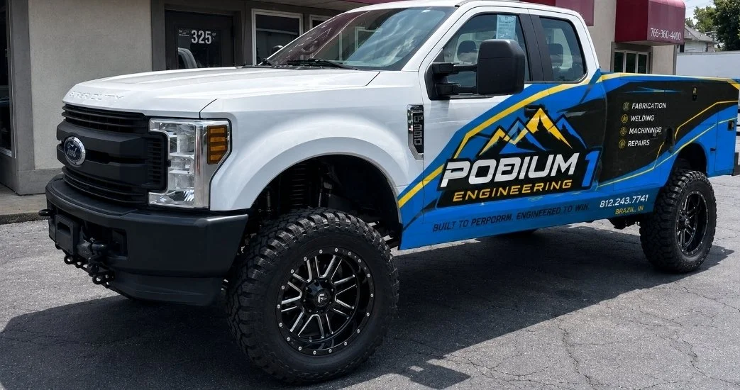 Ford F-250 custom wrap and service bed for Podium 1 Engineering. Specializing in Fabrication and Repair of UTV's, Side x Sides, Trucks, and Industrial Repair.