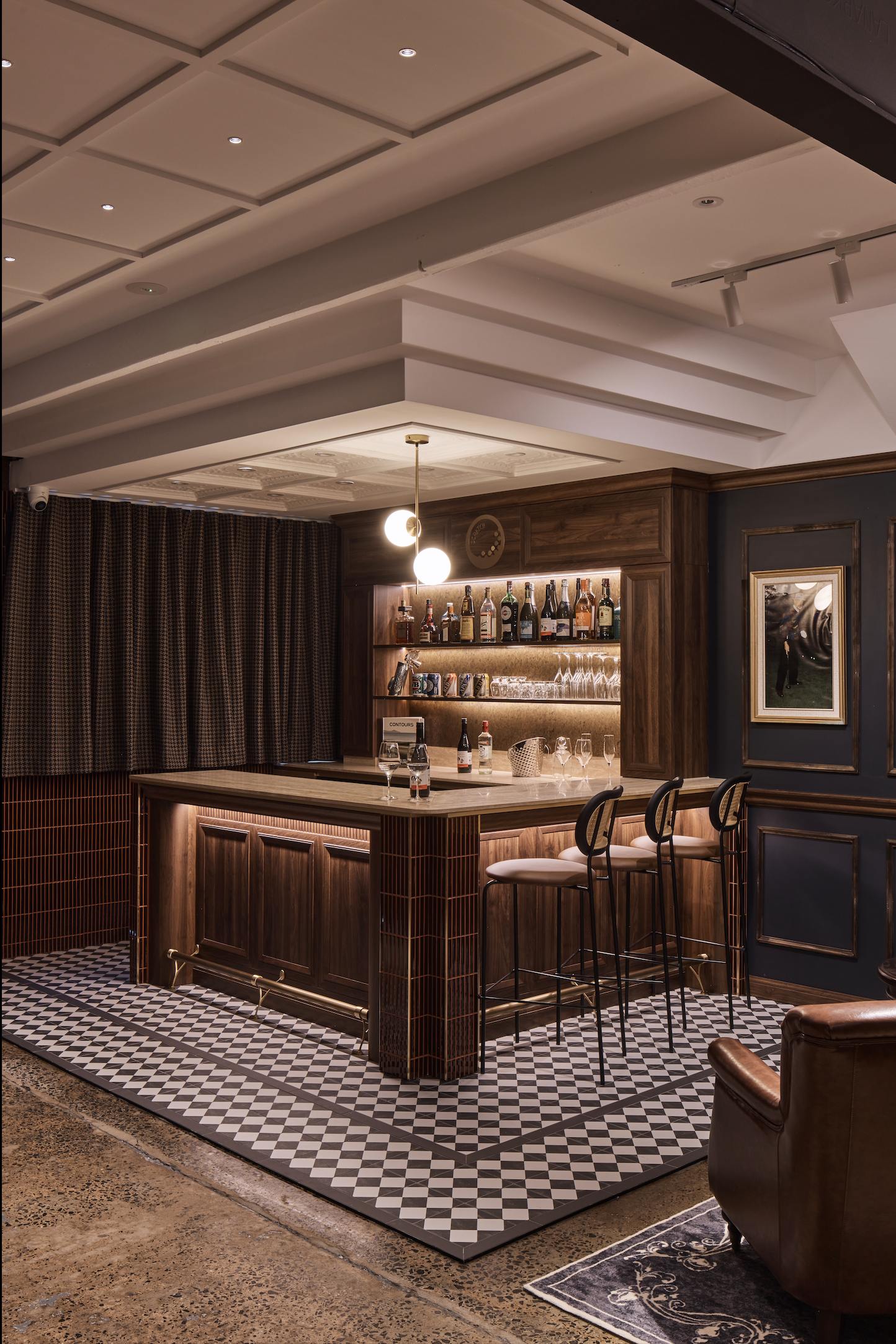 Scratch Golf Studio Marrickville commercial fit-out featuring custom timber bar joinery, decorative wall panelling, geometric floor tiles, leather lounge seating and feature lighting – Sydney City Renovations.