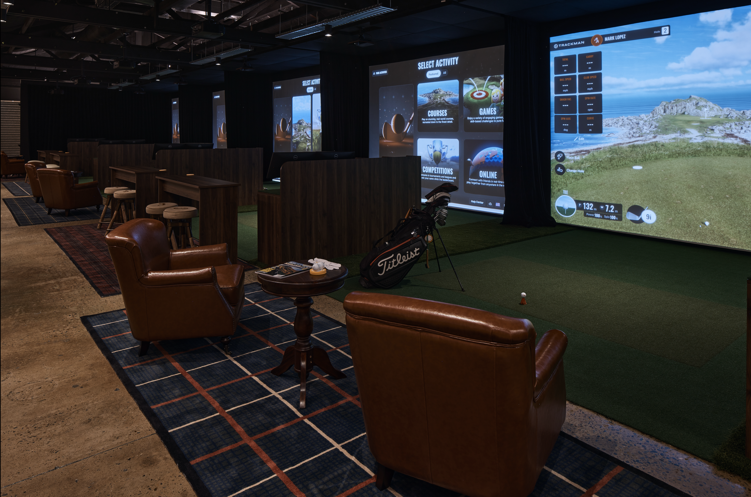 Scratch Golf Studio Marrickville commercial fit-out featuring TrackMan golf simulators, custom timber bay partitions, leather lounge seating, feature carpets and industrial-style finishes – Sydney City Renovations.