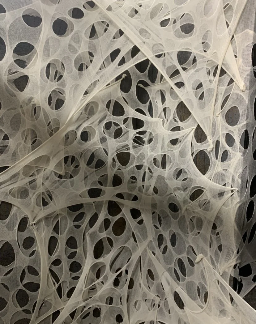 Layered cheese cloth spider webs