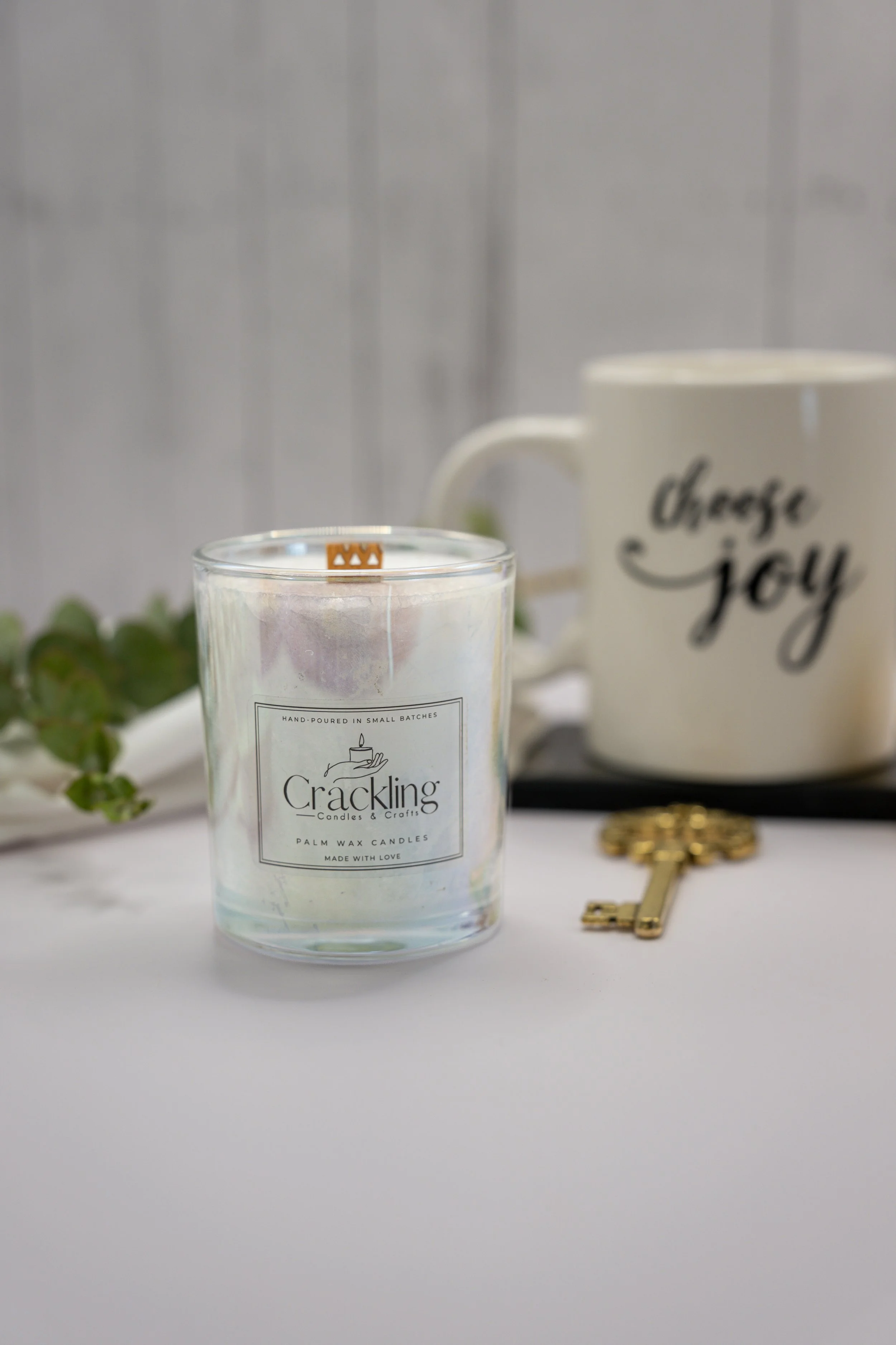 6 oz Blood Orange palm wax candle with a wooden wick, styled with a Choose Joy mug, fresh greenery, and an antique brass key.