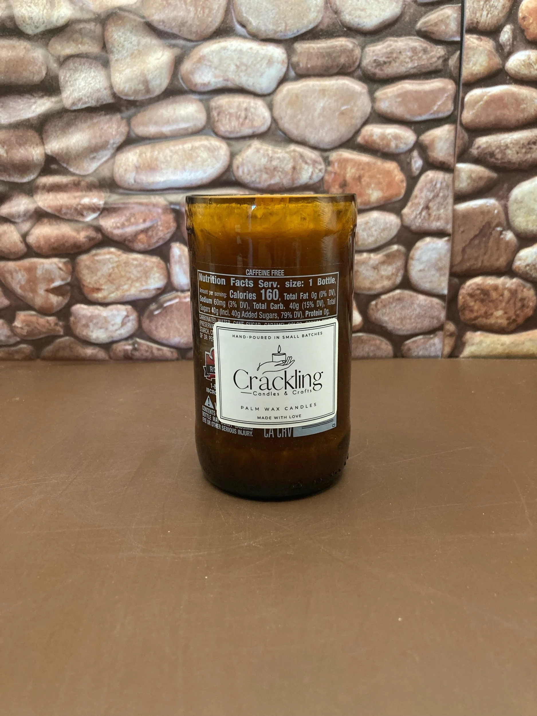 IBC Root beer Upcycled bottle candle. Scented as Cafe DE Olla candle with a wooden wick. With Palm Tree wax, it gives it a Crystal look. Handmade with Phthalate Free natural fragrance oils.