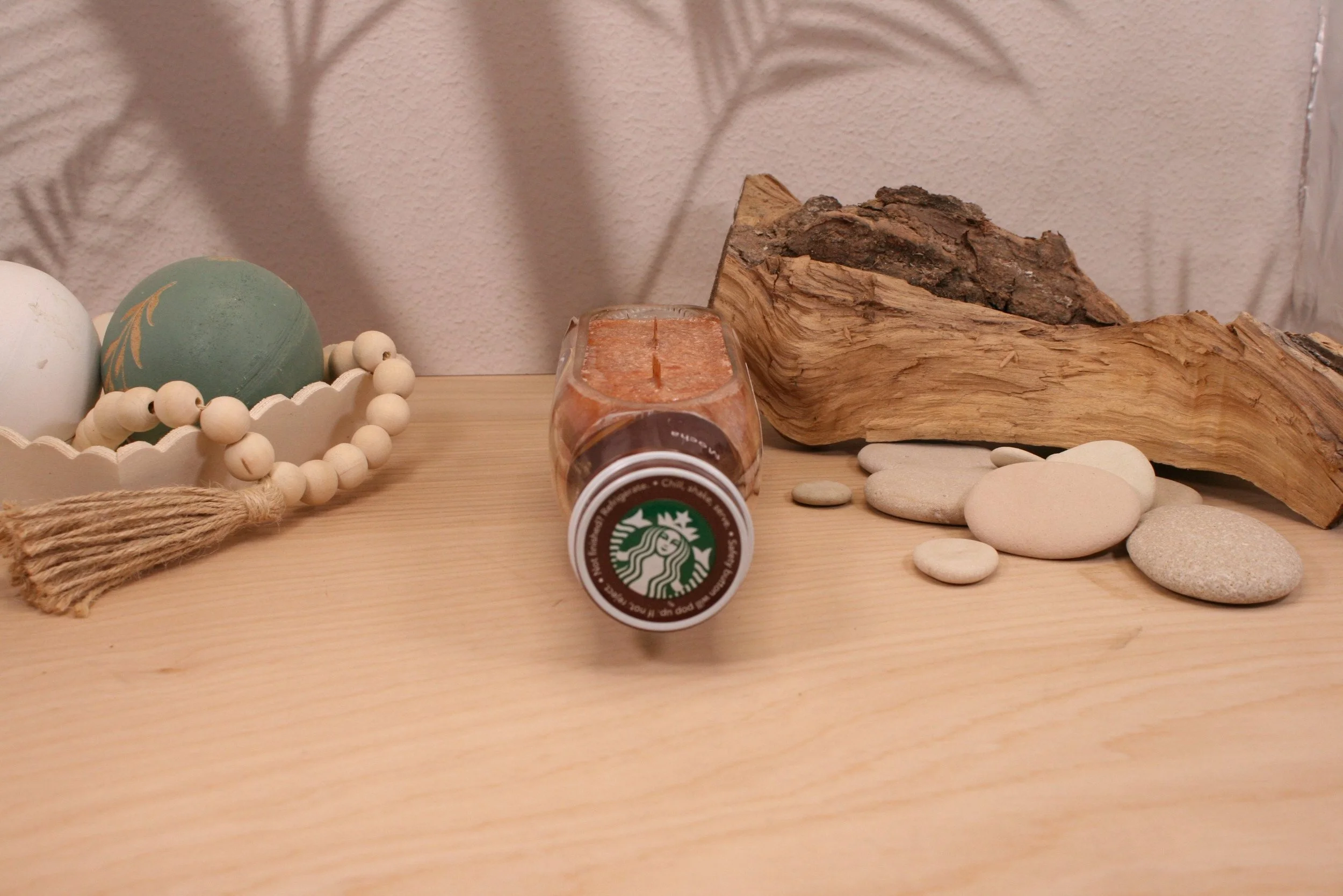 Our Upcycled Starbucks Frappuccino candle is cut on the side, has high temp non-skid pads for safety. Adds a unique addition to any space