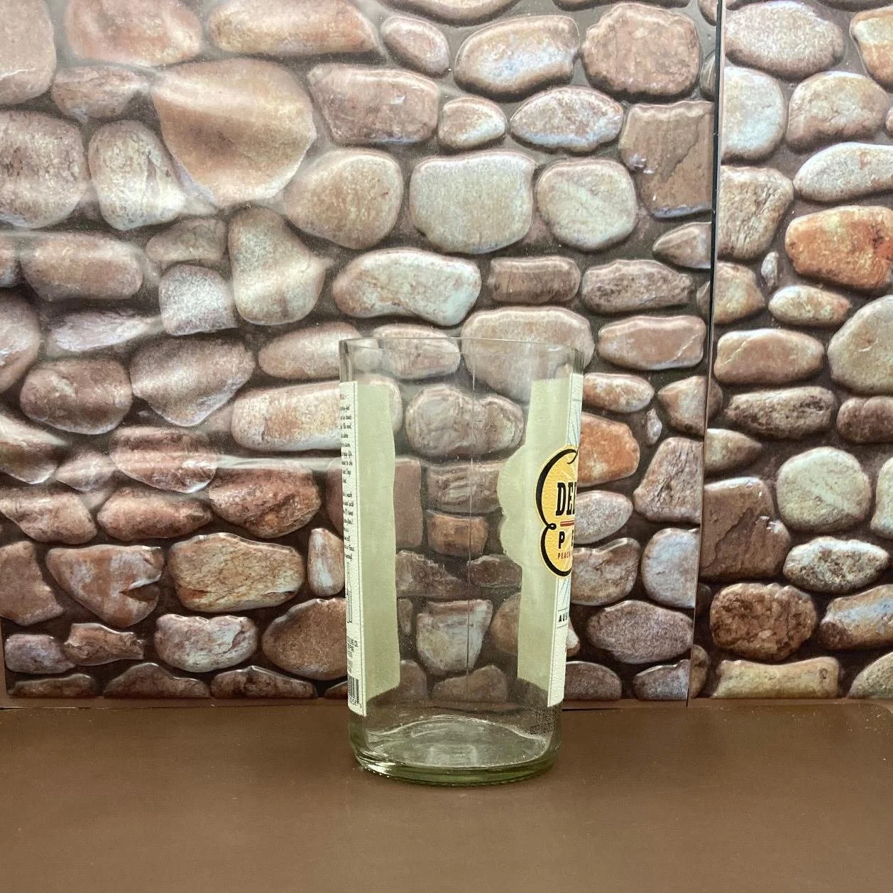 Deep Eddy Upcycled Peach Vodka Bottle Candle. Comes with a custom made wood wick. Makes a unique a unique gift.