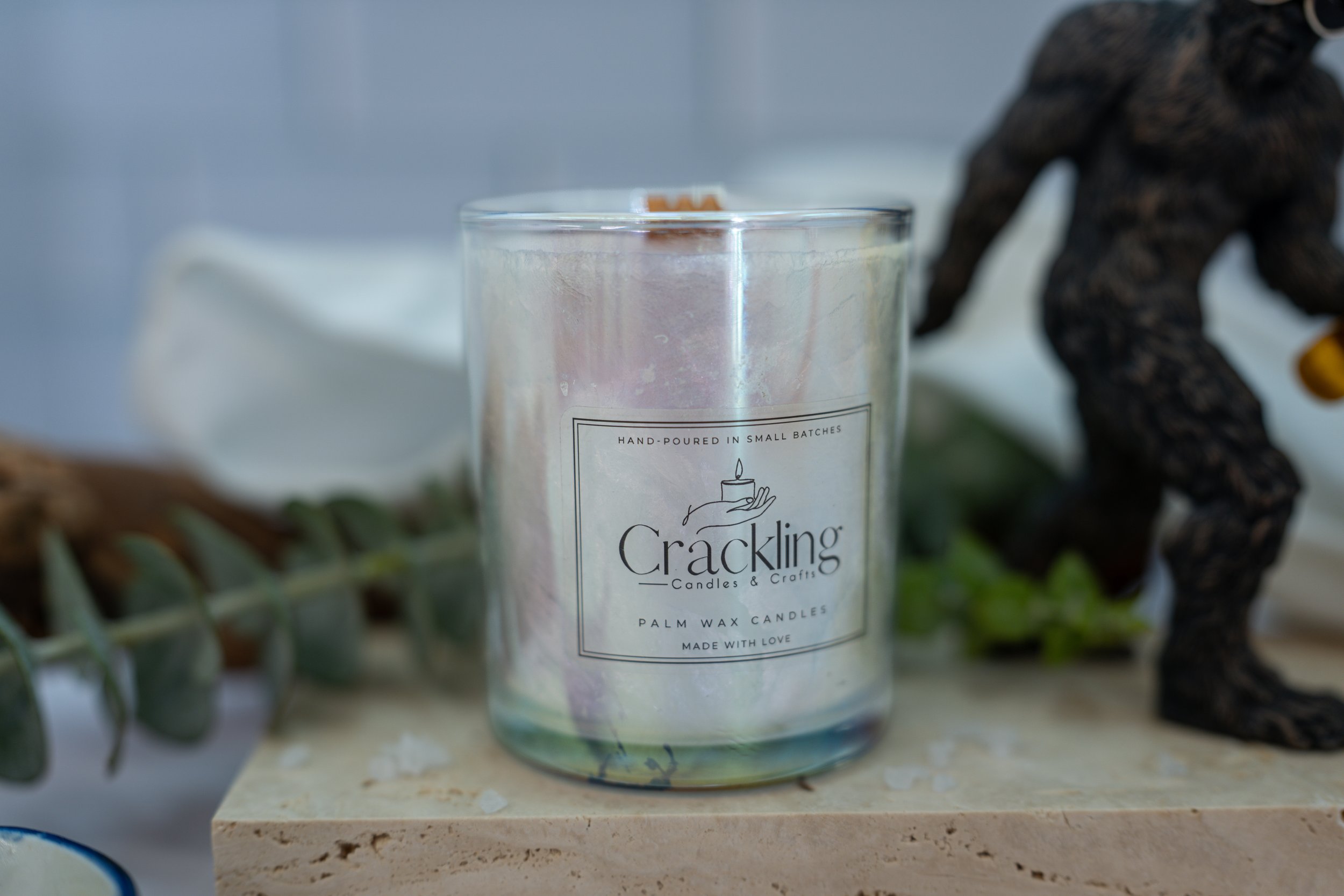 Close view of the White Sage & Sea Salt palm wax candle and wooden wick