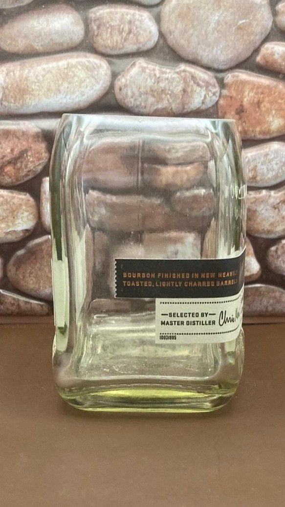 Woodford Upcycled whiskey bottle candle. Holds 19 OZ of wax. Comes with a wooden wick. Great gift for someone special or for yourself.