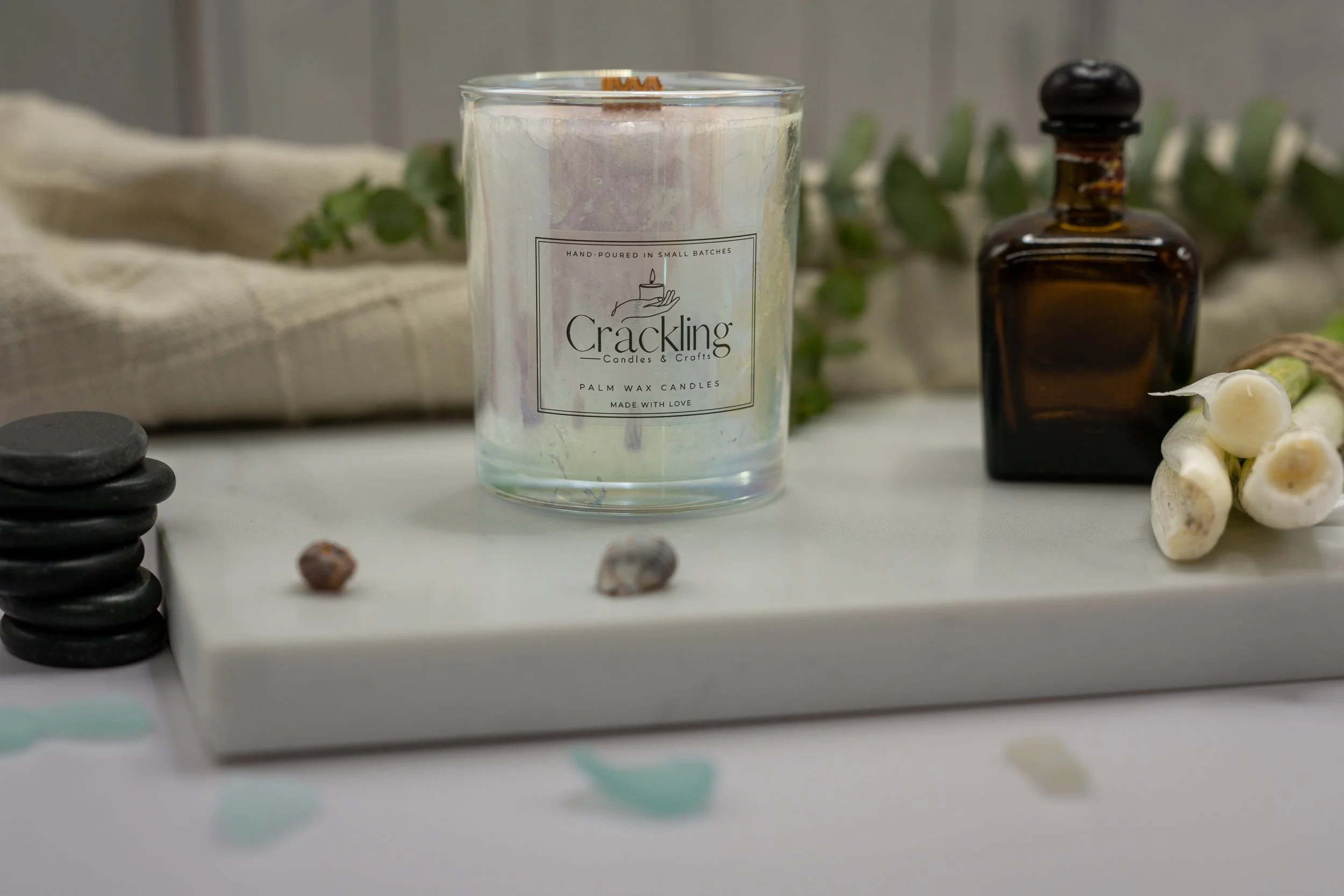 Close-up of Lemongrass palm wax candle showing its wooden wick, crystalline wax, and Crackling Candles & Crafts label.