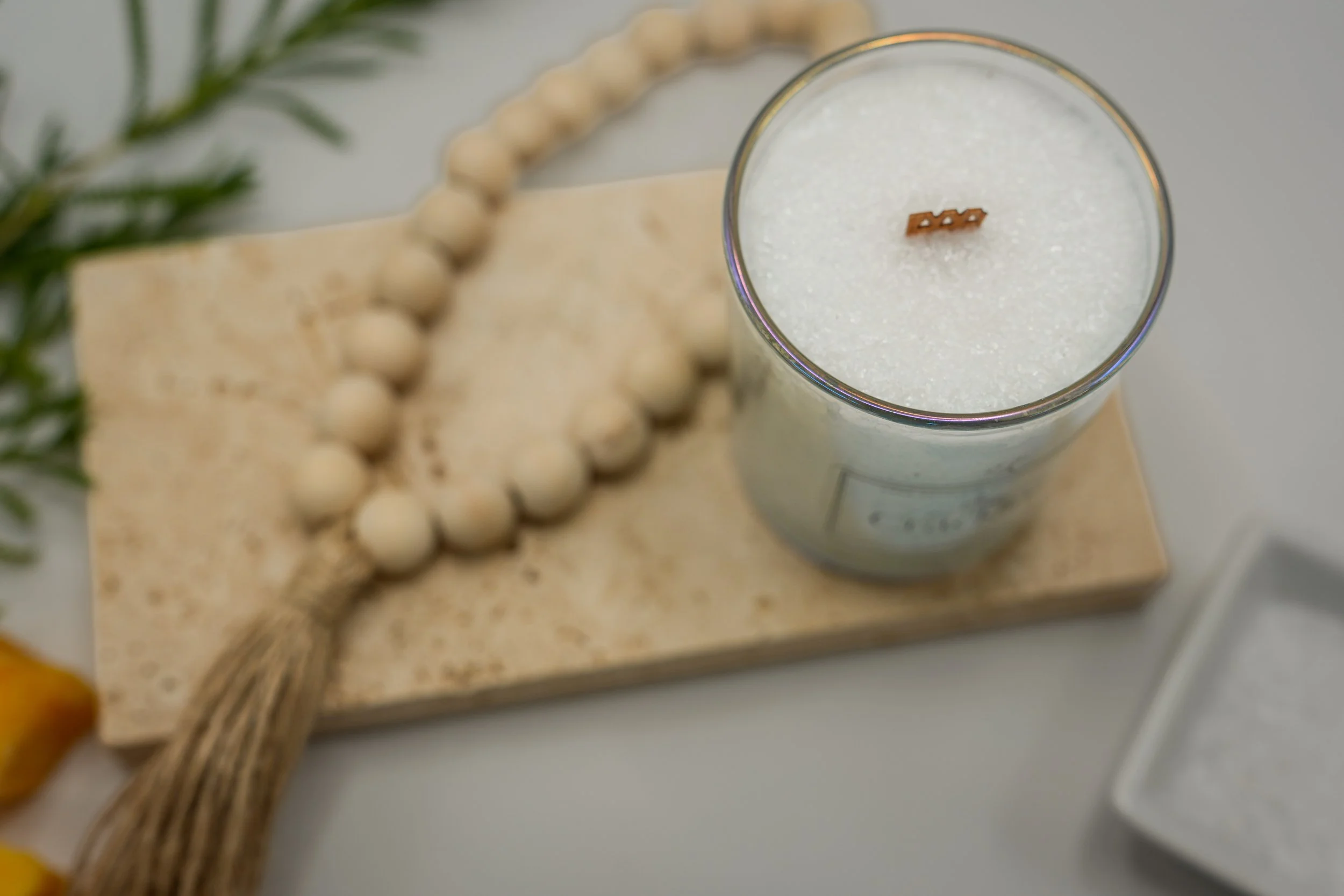 Top view of the Island Mango candle showing its palm wax and wooden wick