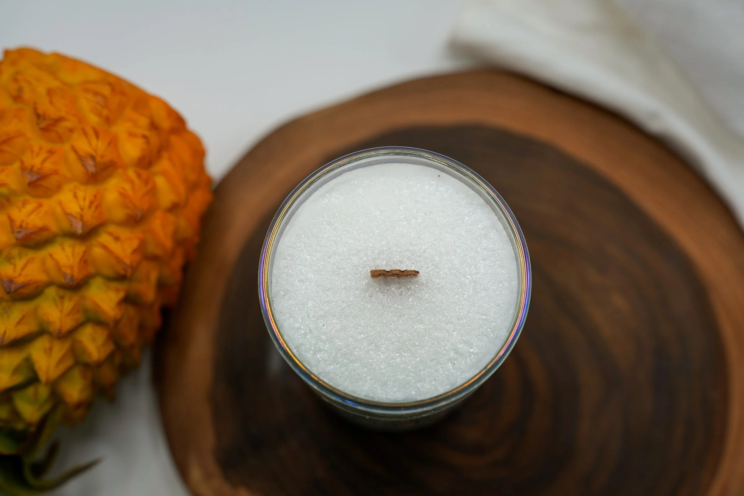 Top view of the Iced Pineapple candle showing its palm wax and wooden wick