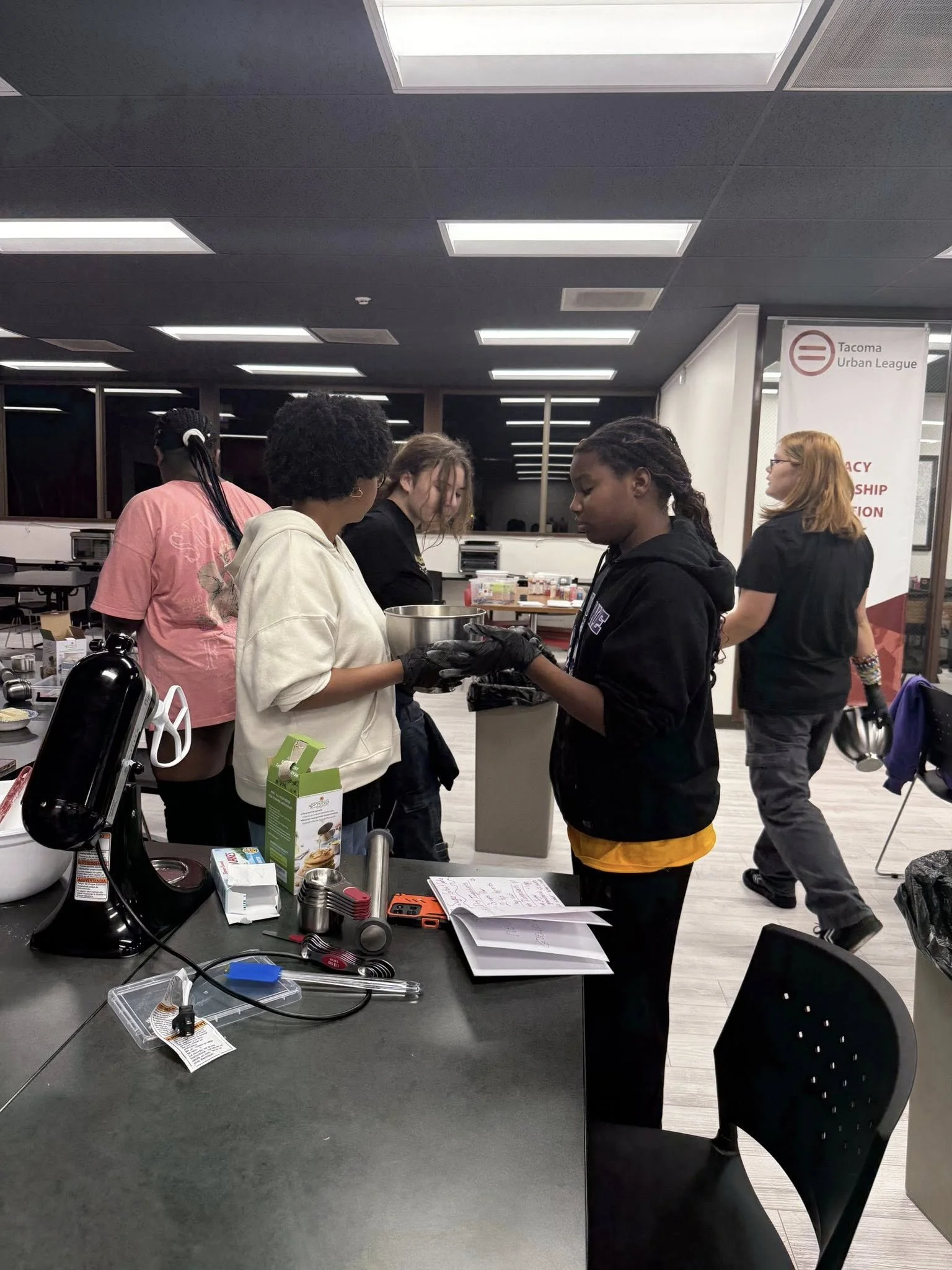 Group of students learning at the Junior Bakers Club