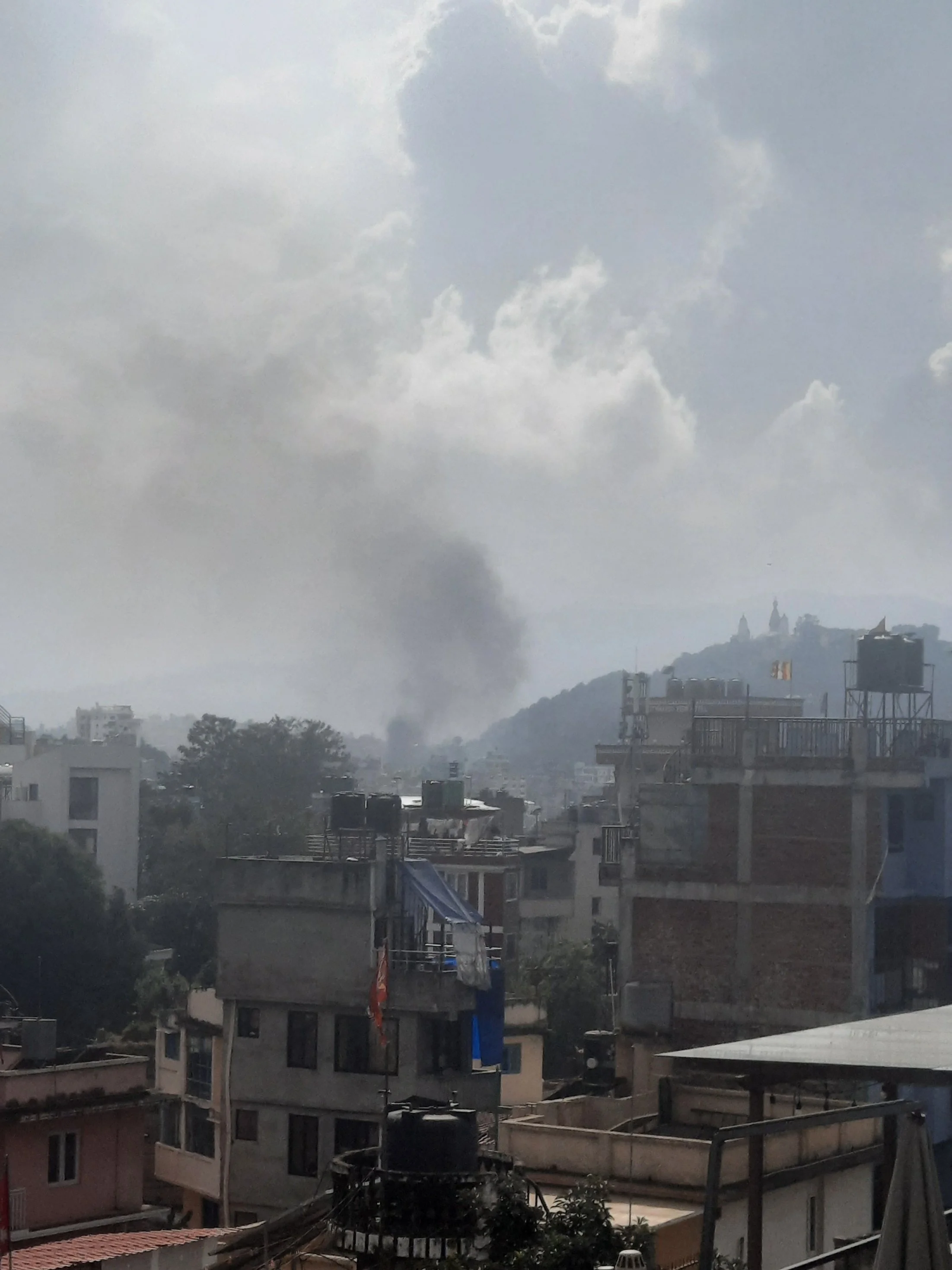 Watching the smoke rise - from our rooftop vantage point
