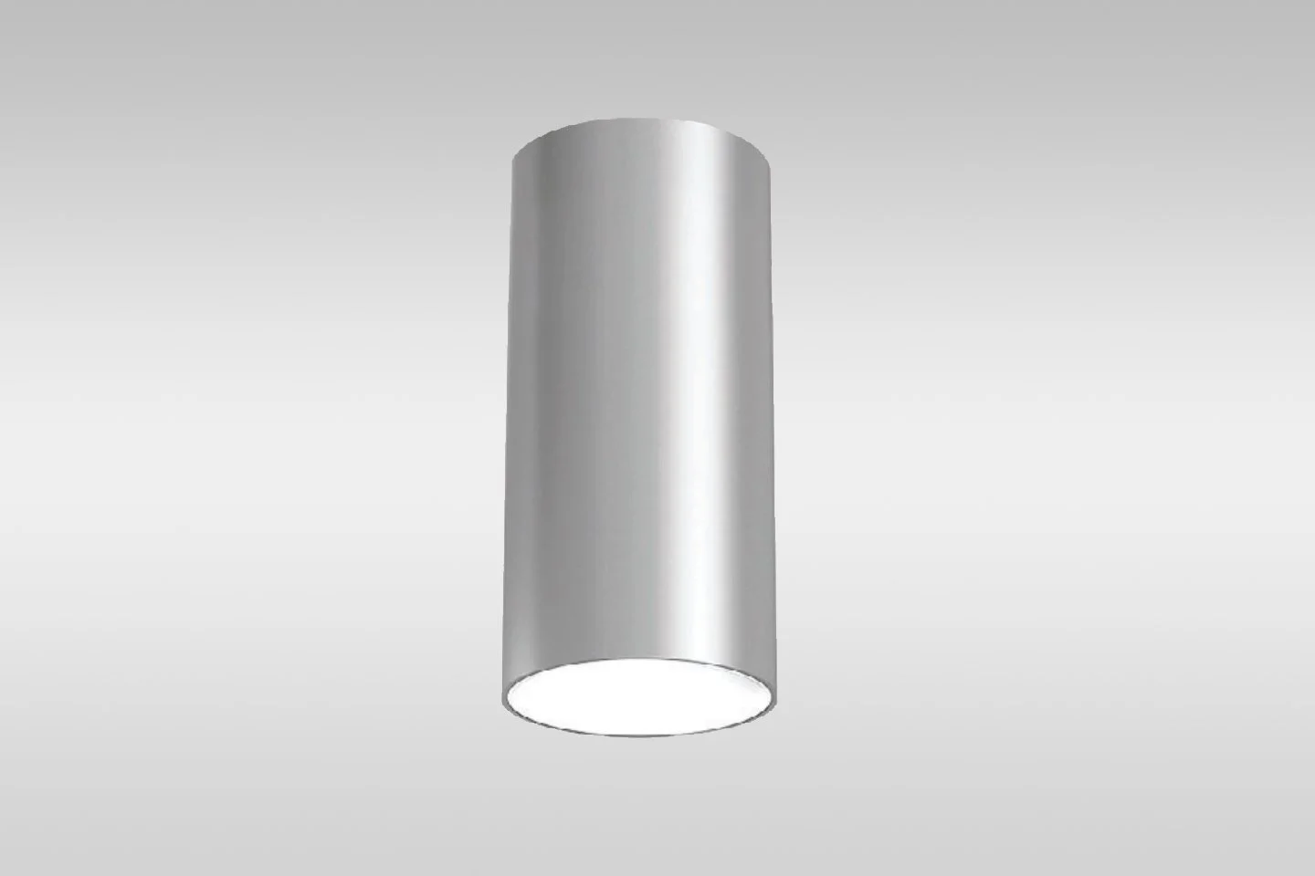 Silver cylindrical downlight fixture with a circular opening at the bottom.