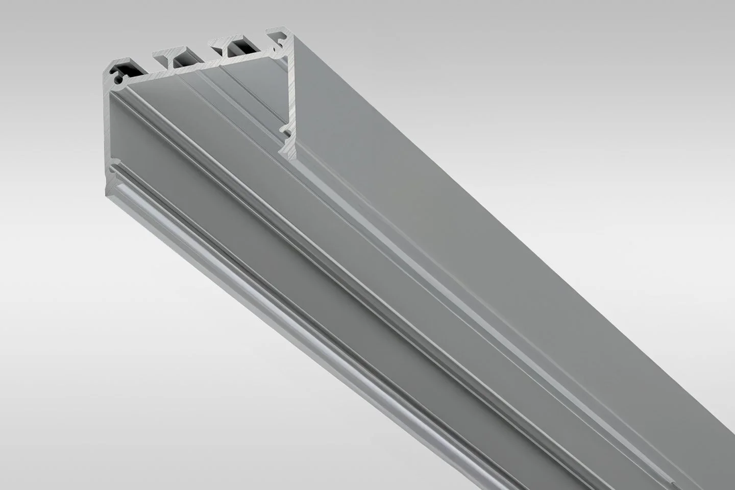 A close-up view of an aluminum extrusion with grooves and mounting features, often used for structural framing or assembly projects.