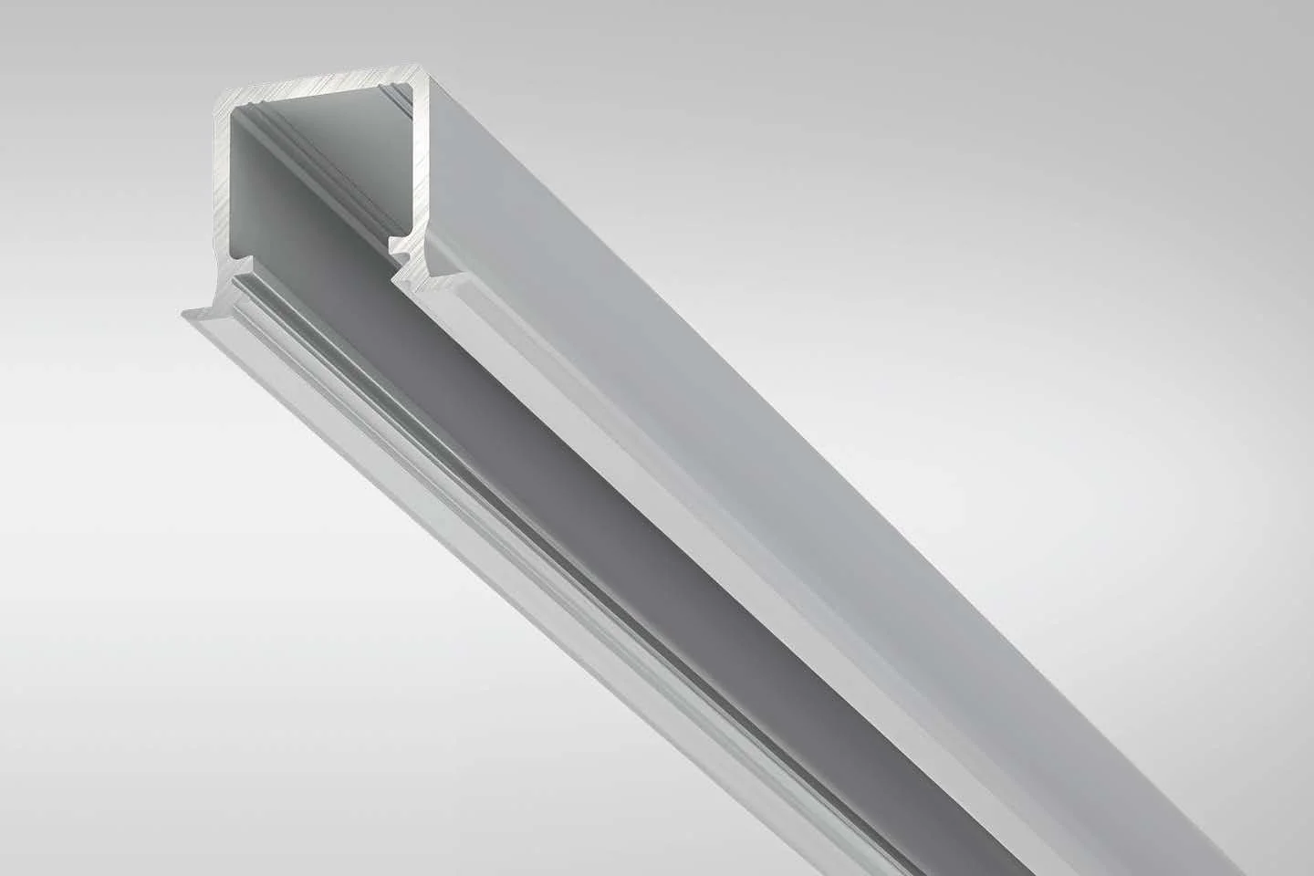 A close-up view of a metallic aluminum extrusion profile against a gradient gray background.