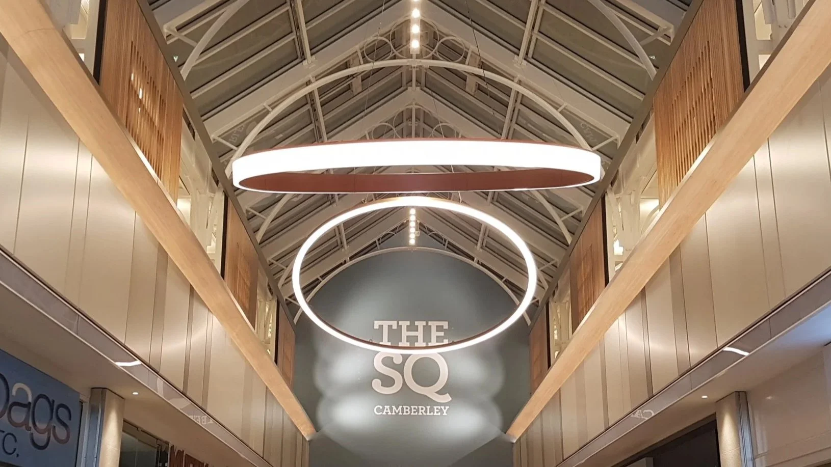 Modern circular LED pendant light hanging from ceiling