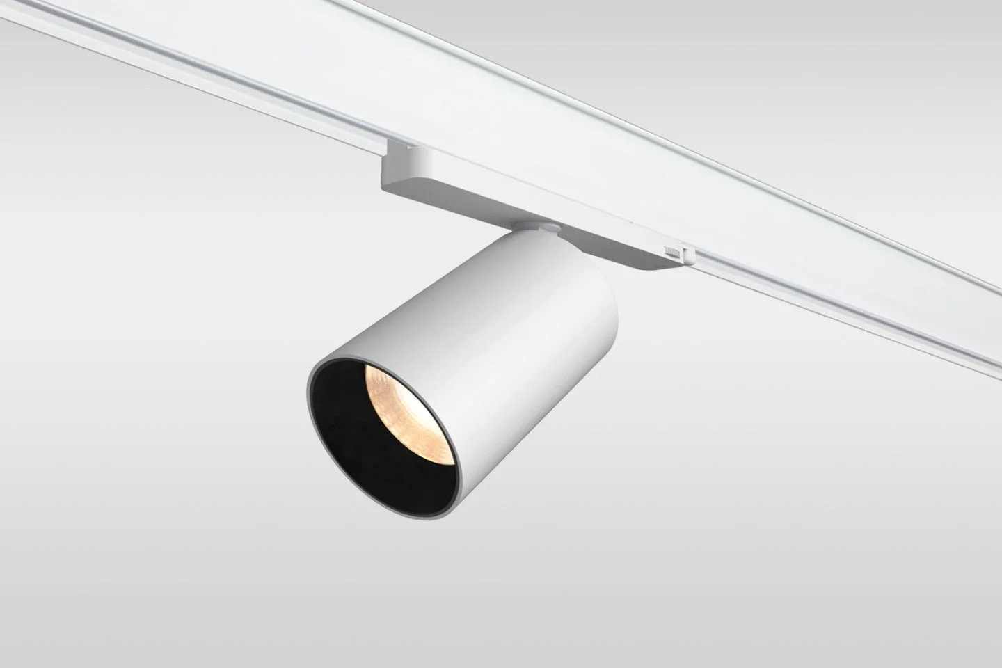 White track lighting fixture with one adjustable spotlight
