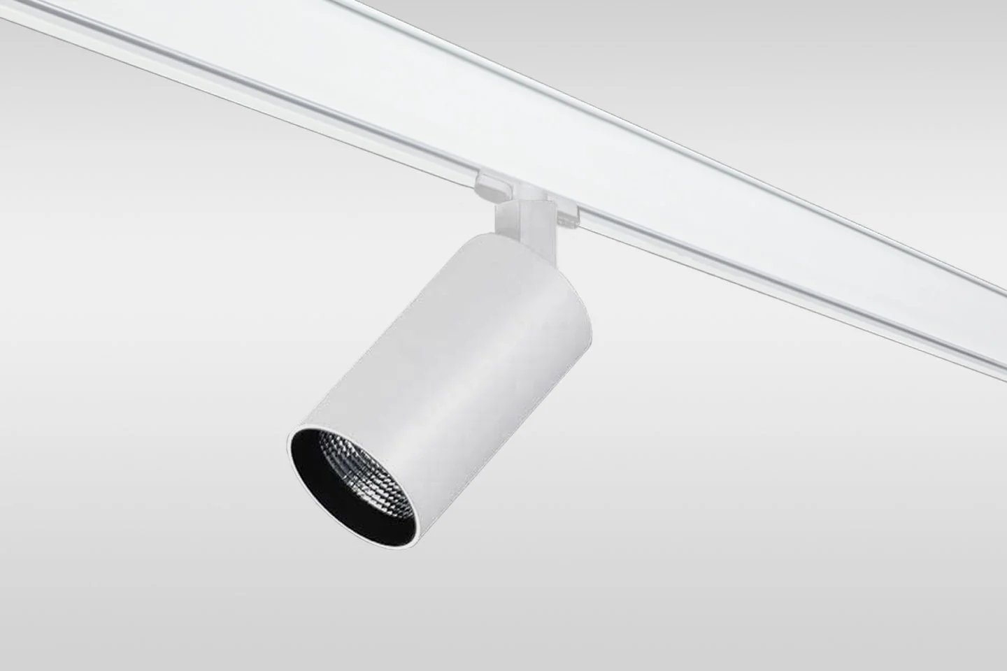White ceiling track light fixture with a single adjustable spotlight against a plain white background.