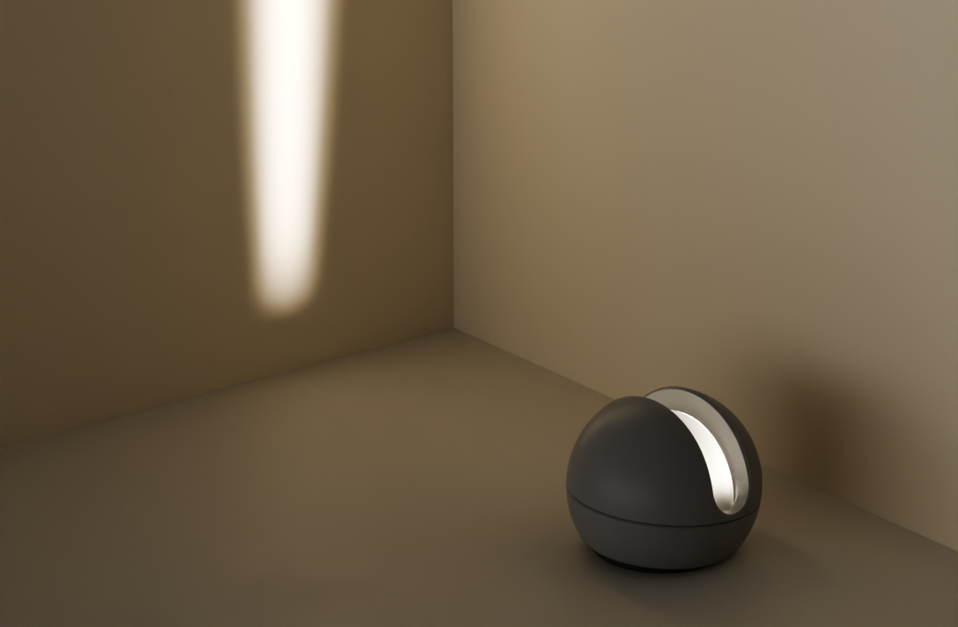 A small black and white portable speaker on a gray surface in a beige corner, with a vertical streak of light on the wall.