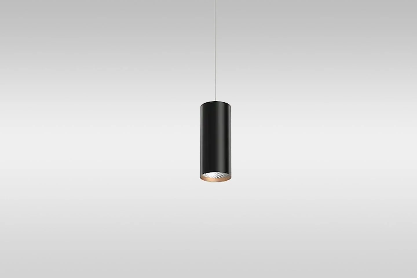 A black cylindrical pendant ceiling light hanging from a thin wire against a plain white background.