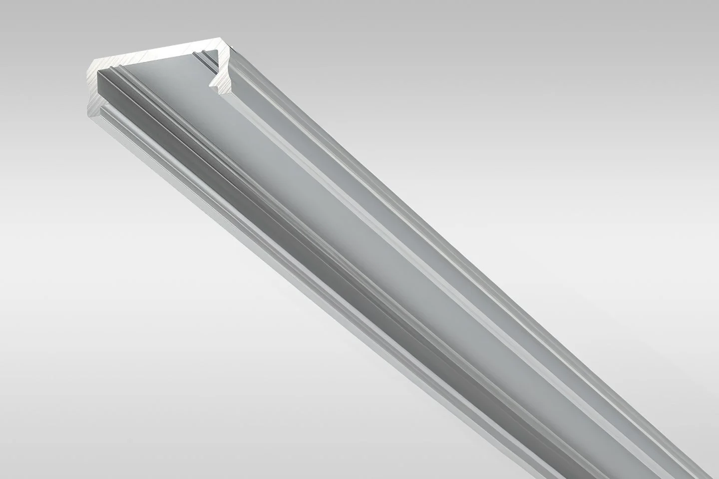 Close-up of a silver metallic LED linear light fixture against a plain grey background.
