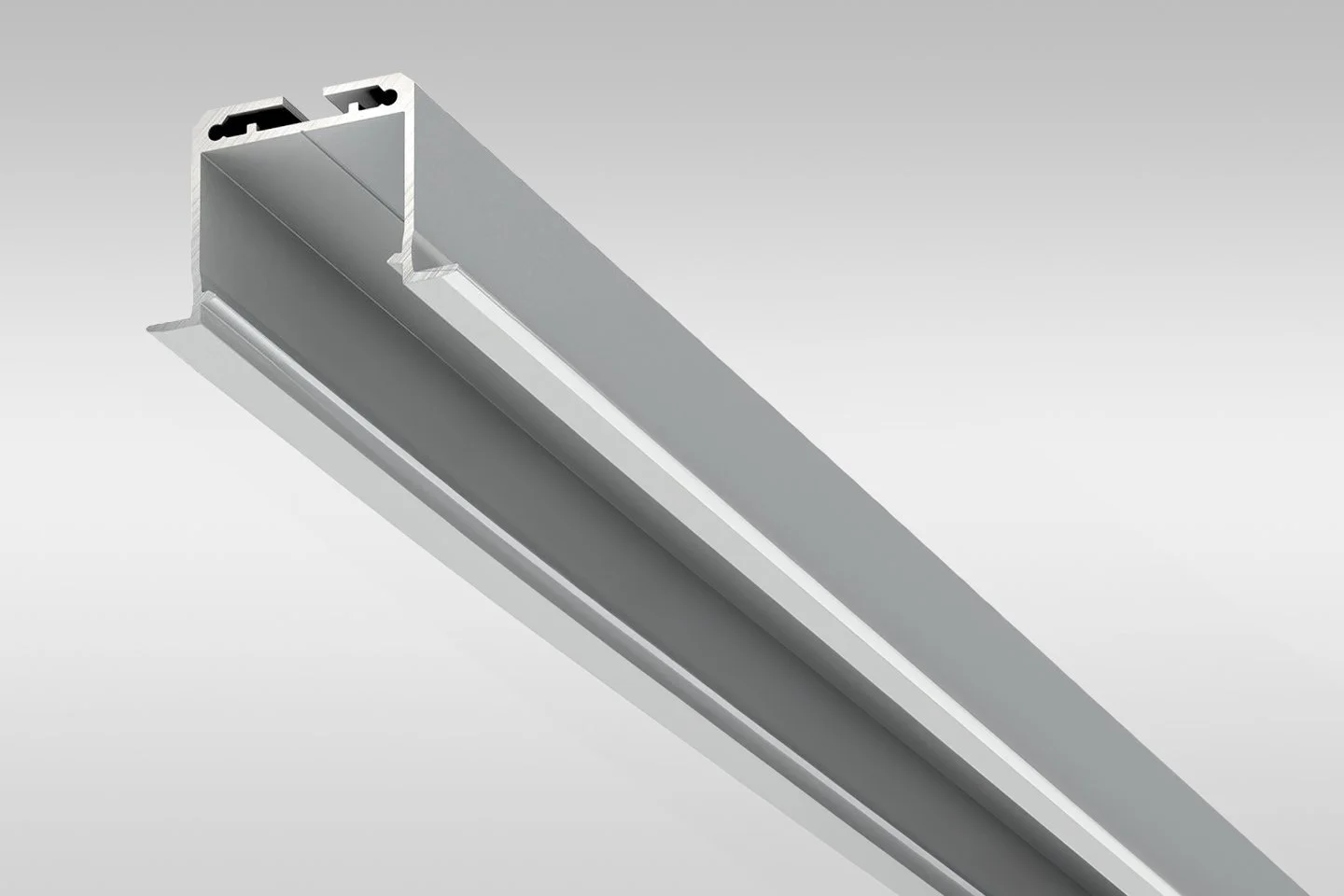 A metallic linear lighting fixture with a sleek, modern design, shown from a perspective above.
