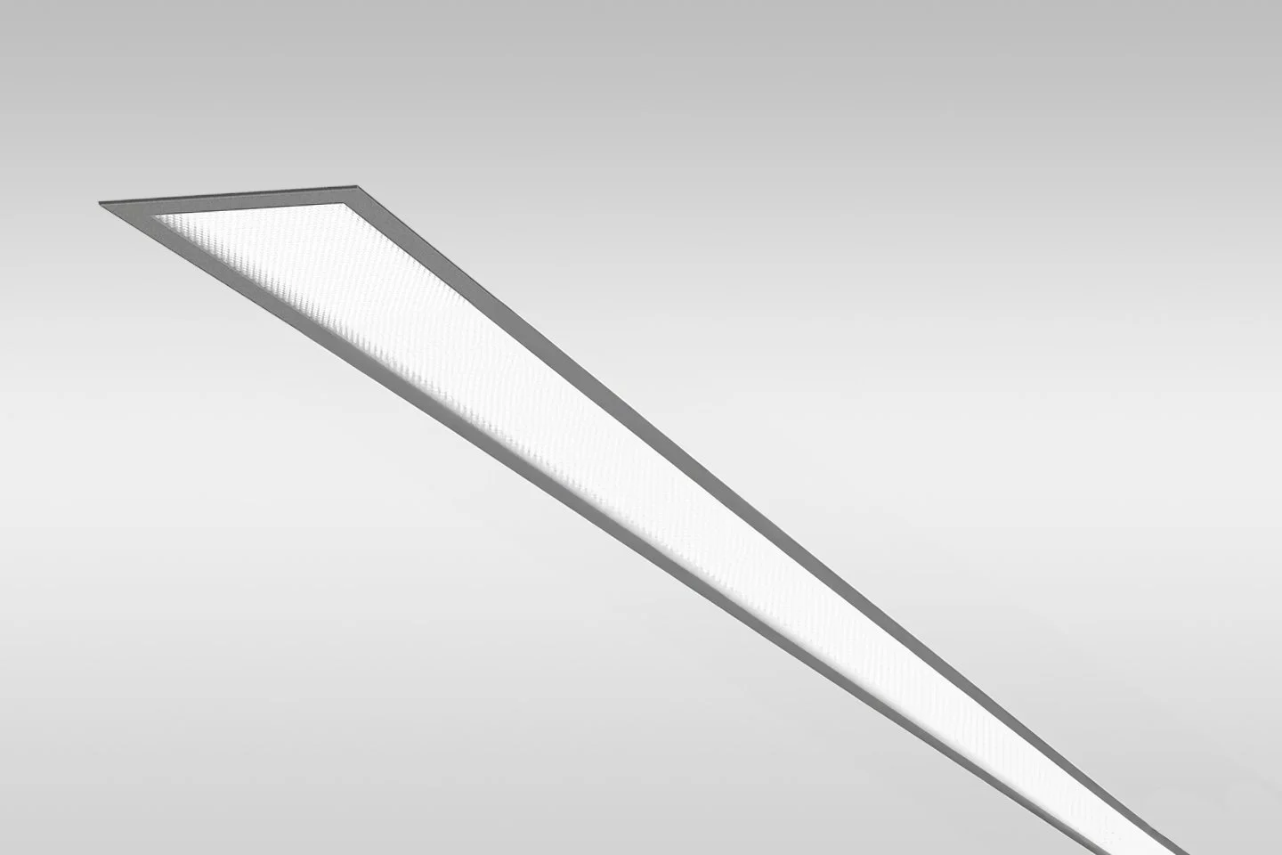 An elongated rectangular LED ceiling light panel installed on a plain ceiling.