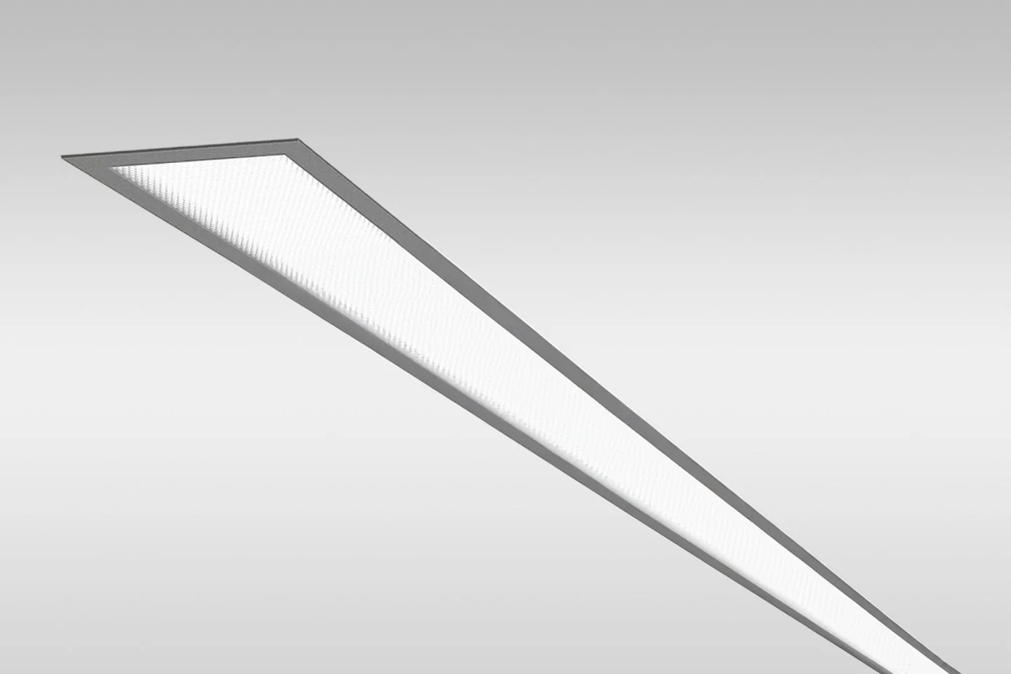 Long rectangular ceiling light fixture installed on a white ceiling.