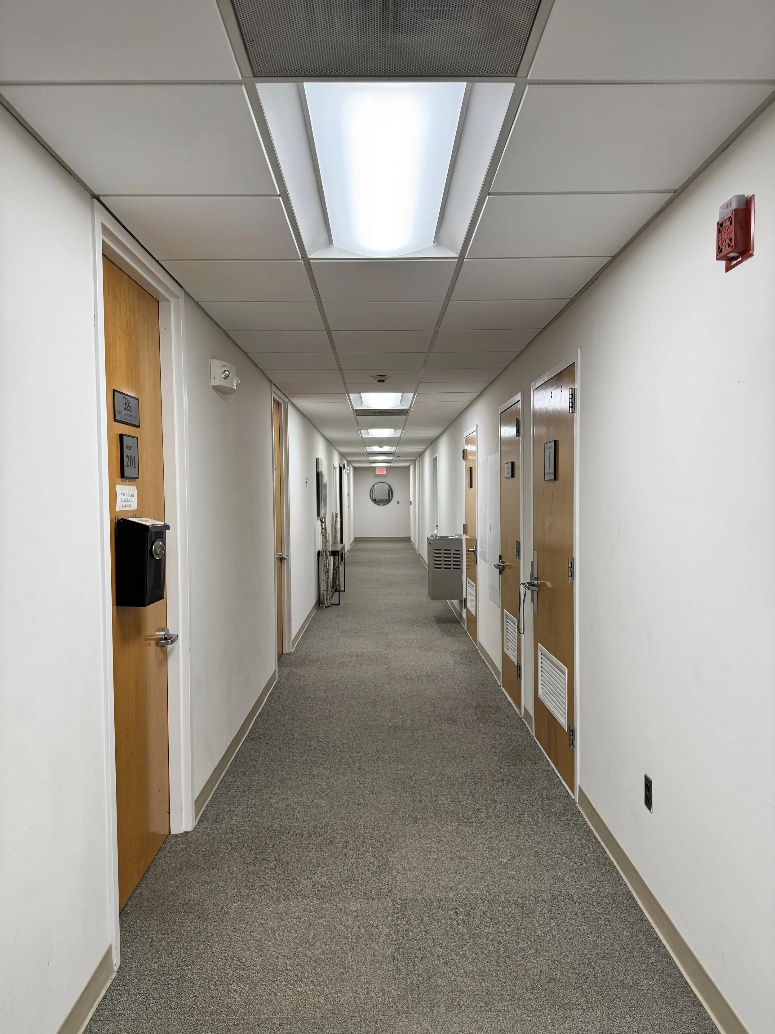 Second-floor hallway leading to the Bridging Bonds therapy suite in Parsippany, NJ
