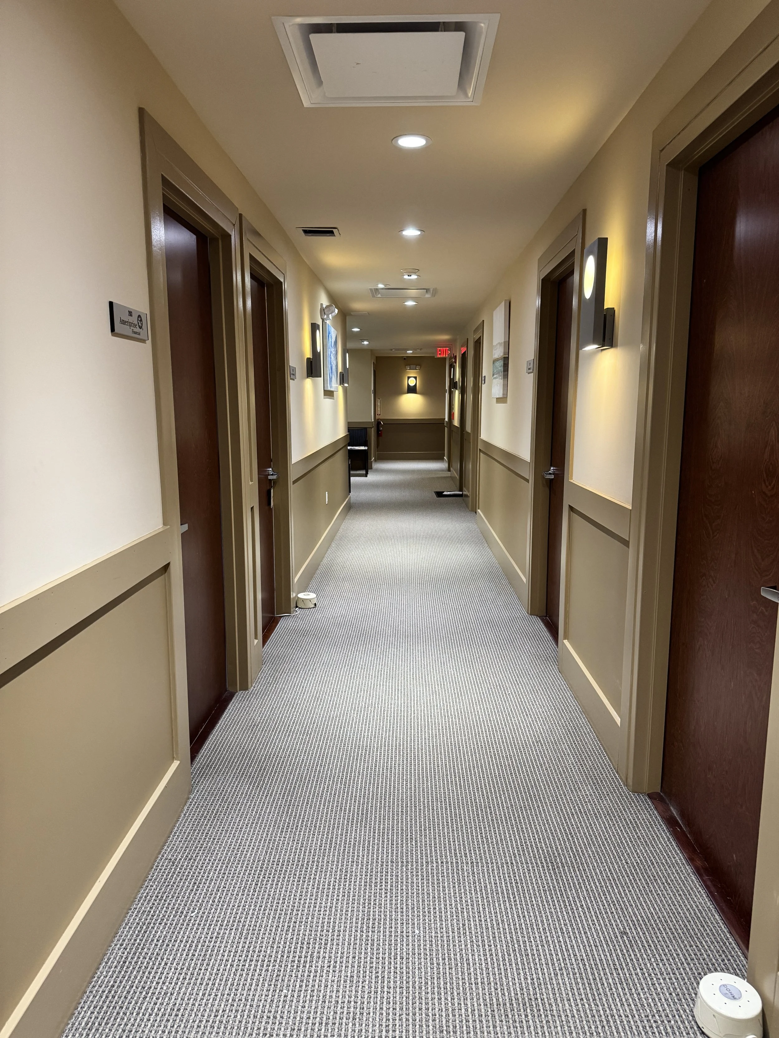 Follow the hallway all the way to the end. Our private therapy office is located behind Door 207 ( within shared suite of Rooted Healing), offering a quiet, confidential, and comfortable environment for your sessions.