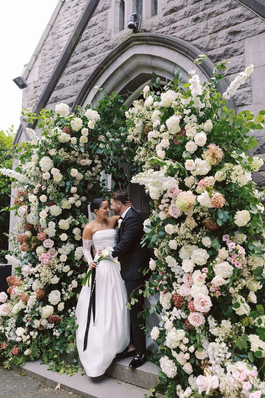 Bride and groom fairytale flower arch