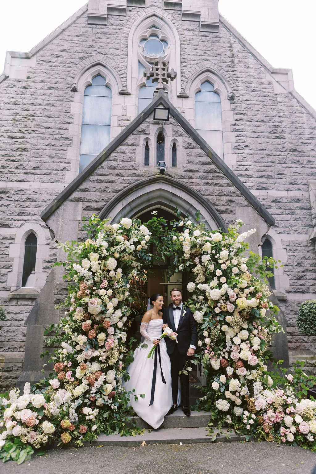 Lucury Destination wedding Ireland Bride and groom wedding flower arch