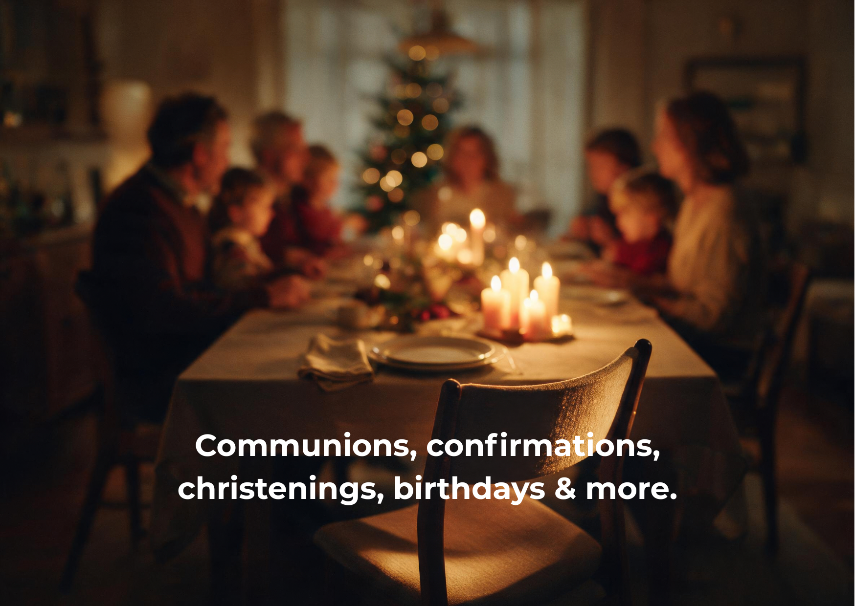 A family gathered around a dinner table decorated with candles and a Christmas tree in the background, celebrating Christmas.