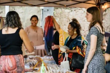 Visitors browsing an Aboriginal market stall at Wardarnji.