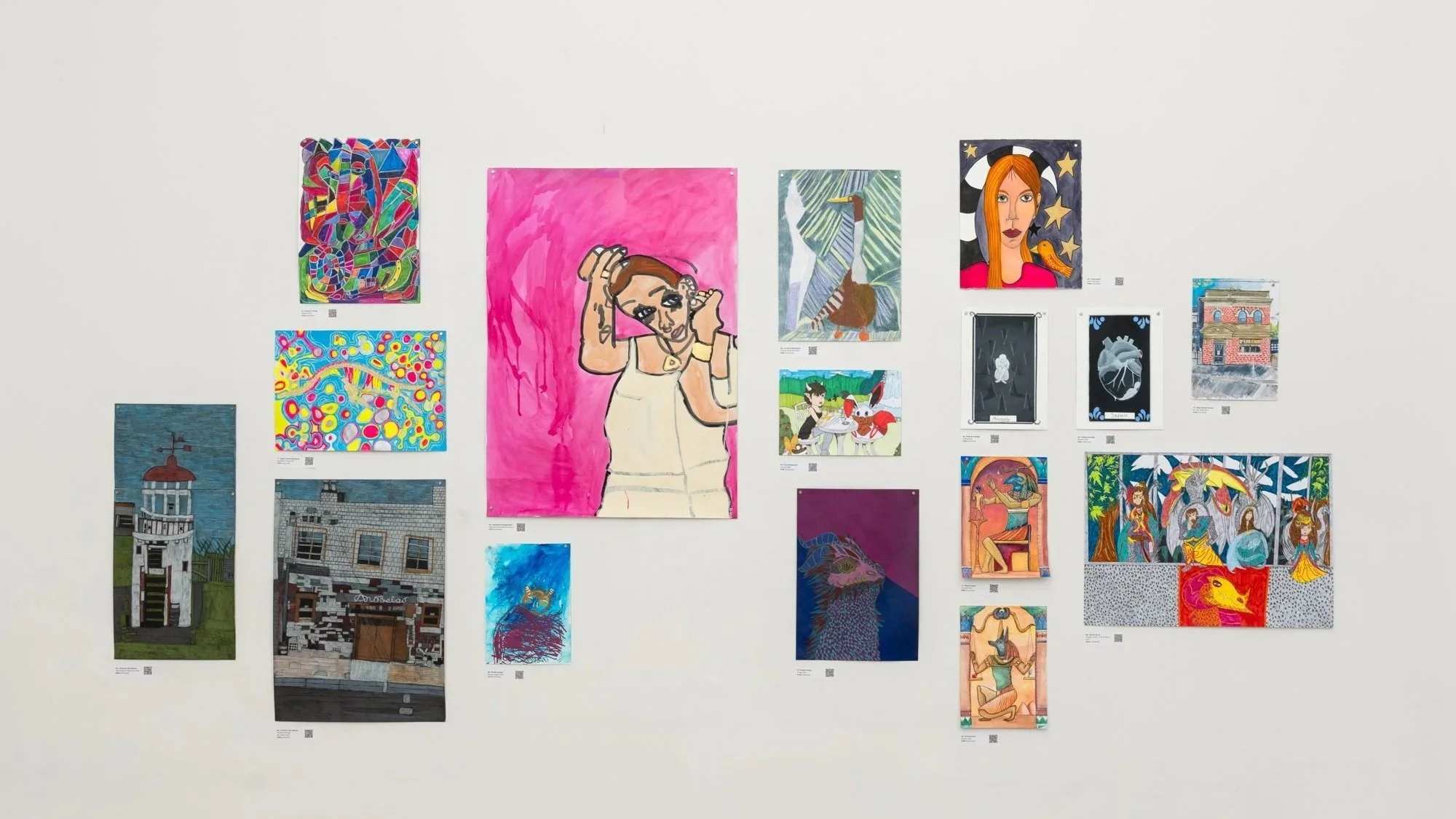 Small artworks displayed on a gallery wall at MULTIPLICITY.