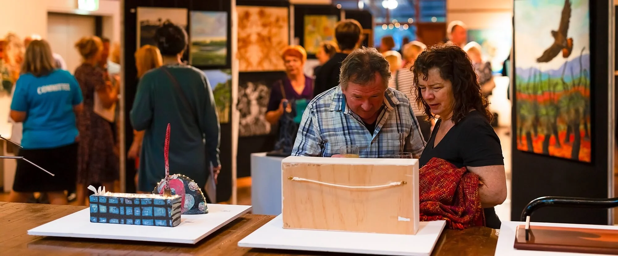 Visitors viewing artworks at Darlington Arts Festival.